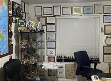 Leon Hochman's travel room, with a world map, his <b><i>ITN</i></b> Travel Awards and souvenirs of his travels.